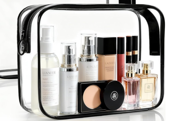 A clear TSA-approved bag with travel-sized toiletries including a perfume bottle