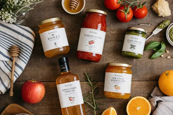 High-quality glass food jars filled with colorful preserves and condiments