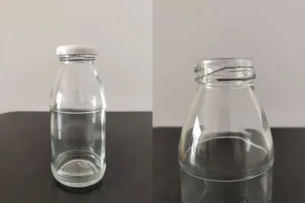 Glass juice bottles with 38mm lug caps ready for hot filling