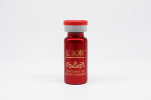 Red electroplated glass bottle with gold hot stamped logo and lettering